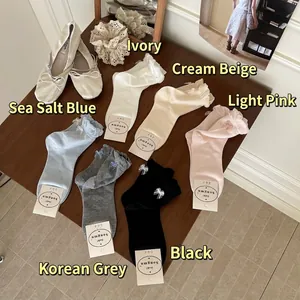 Pastel cotton crew socks with bow ribbons and ruffle cuffs in six assorted colors