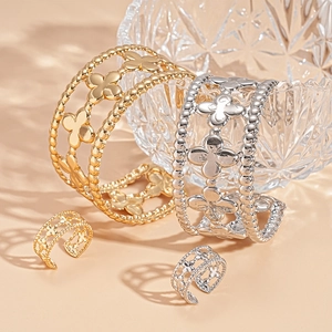 Golden and silver hollowed clover bangle and ring set with beaded edges in elegant style