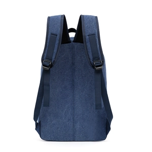 Classic navy blue canvas backpack with adjustable padded straps and top handle on white background