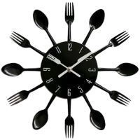 Close-up of modern wall clock featuring black metal fork and spoon utensil markers