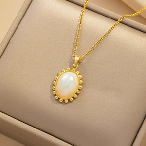 Elegant gold titanium steel necklace with an oval iridescent mermaid pendant in a box