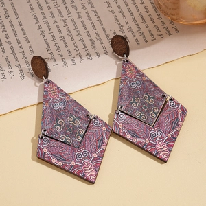 Bohemian geometric wooden earrings with vintage diamond patterns on a beige background