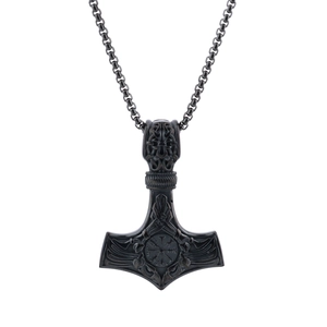 Macro view of Viking Mjölnir pendant with intricate Vegvisir engraving and chain