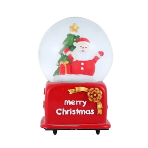 Detail of Christmas snow globe with Santa Claus, Xmas tree and Merry Christmas base