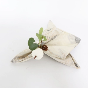 White pumpkin napkin ring with eucalyptus leaves and pinecone for Thanksgiving decor