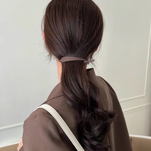Brown matte hair claw clip shown from back view on model's hair for elegant styling