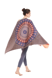 Detailed view of bohemian mandala beach towel with intricate orange and blue patterns