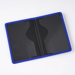 Detail view of blue passport holder featuring two transparent internal slots for cards