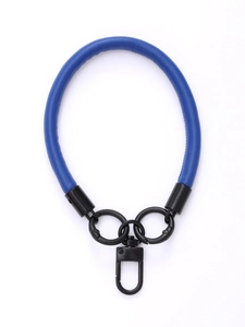 Detail of blue leather phone wrist strap with black metal rings and swivel snap hook