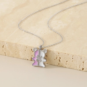 Minimalist stainless steel bear pendant necklace with pink and white enamel and rhinestones