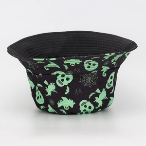 Detail view of black Halloween bucket hat with fluorescent green ghost and skull prints