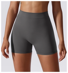 Macro detail of wide high-waisted waistband on dark grey matte yoga shorts for tummy control