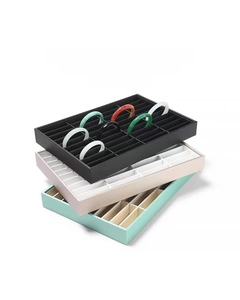 Multiple grid jewelry tray in black and pink for bracelet display and storage