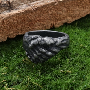 Vintage silver stainless steel handshake ring with a rustic industrial textured finish