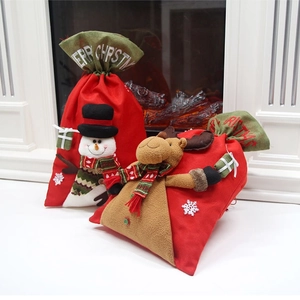 Large Christmas gift bags with 3D snowman and reindeer dolls on festive red fabric