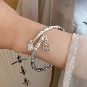 Elegant silver bamboo open bangle with peace pendant and leaf charm in Neo-Chinese style