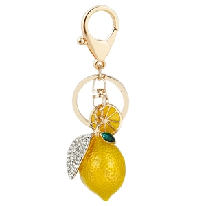 Sparkling lemon keychain with vibrant rhinestones and golden hardware for handbags