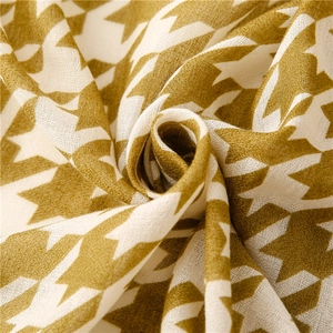 Macro shot of houndstooth weave pattern in yellow and white soft fabric texture