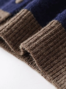 Detailed macro view of heavy knit stripes in navy and brown with thick ribbed texture