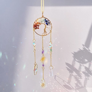 Macro detail of Tree of Life suncatcher with colorful crystals and rainbow prism reflection