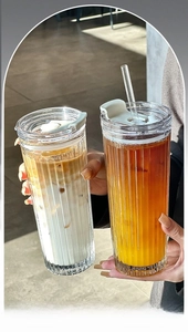 Detailed view of large vertical stripe glass coffee cup with lid and dual-use straw