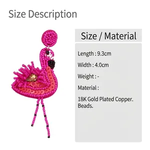 Detail showing 9.3cm handmade pink flamingo beaded earrings with size measurements