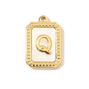 Detail of a gold rectangular pendant with shell inlay and a metallic letter Q charm