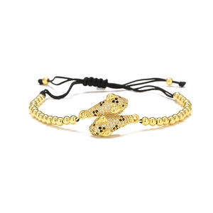 Detailed view of 18K gold plated leopard head bracelet with white cubic zirconia accents