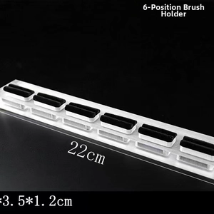 Close-up of clear acrylic 6-slot ring display stand with protective black velvet pads