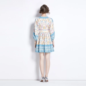 Bohemian print V-neck dress with lantern sleeves, back view of short floral vacation dress