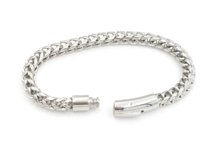 Detailed close-up of polished silver titanium steel wheat chain with magnetic clasp