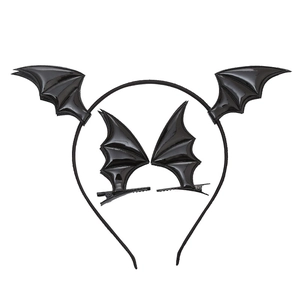 Detail of black glossy bat wing headband and hair clips set for Halloween costumes
