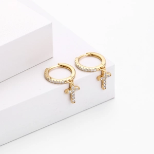 Detail view of gold S925 silver cross hoop earrings with pave cubic zirconia stones