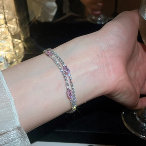 Detailed view of silver-plated double-layer bracelet with sparkling pink zircon stones.