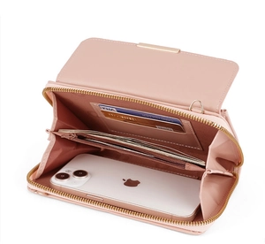 Interior detail of pink leather crossbody phone wallet with card slots and zipper pocket