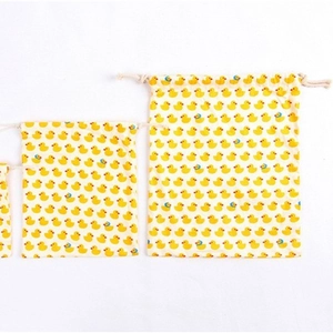 Three sizes of cotton drawstring bags featuring yellow duck prints for storage