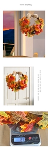Detail showing the 181g weight of the autumn maple leaf wreath with orange berries