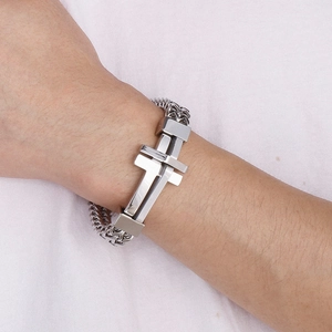 Men's rock style stainless steel chain bracelet with cross design on model's wrist