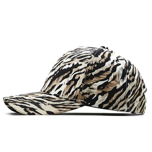 Detail of tiger print baseball cap showing animal texture and curved brim construction