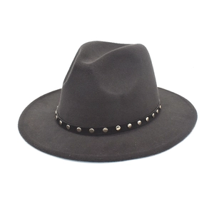 Detailed view of dark grey fedora with silver rivet belt and wide wool brim