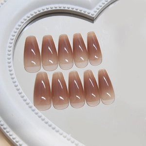 Brown gradient long coffin press-on nails with glossy jelly texture on heart mirror