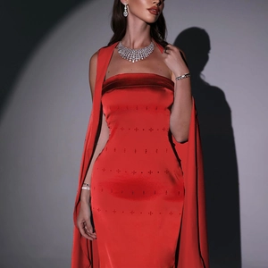 Detail of red satin strapless evening gown featuring matching shawl and diamond jewelry