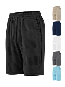 Close-up of waffle knit texture on drawstring shorts with multiple color options