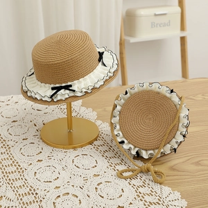 Sweet straw hat and matching bag set with lace trim and elegant black ribbon bows