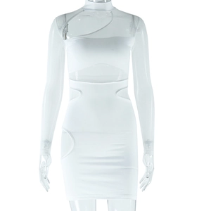 Detailed view of white bodycon dress featuring sheer mesh panels and geometric cut-outs