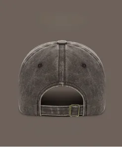 Detail view of washed vintage cotton baseball cap with adjustable antique brass buckle