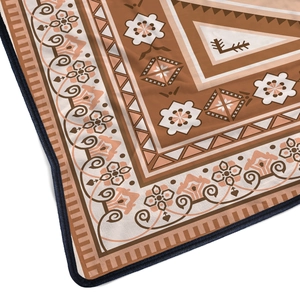 Detailed close-up of Bohemian flannel blanket featuring geometric patterns and soft texture