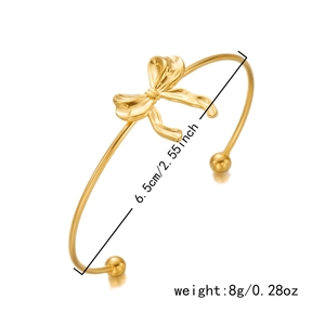 Detailed view of 6.5cm gold bow bangle with weight and diameter measurements