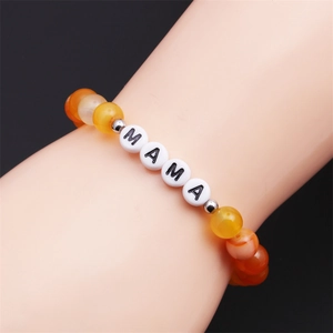 Minimalist Mother's Day beaded bracelet with yellow agate beads and MAMA letter charms