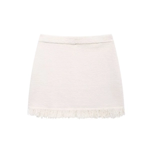 Detailed close-up of white tweed knit mini skirt featuring thick fringe trim on the hemline